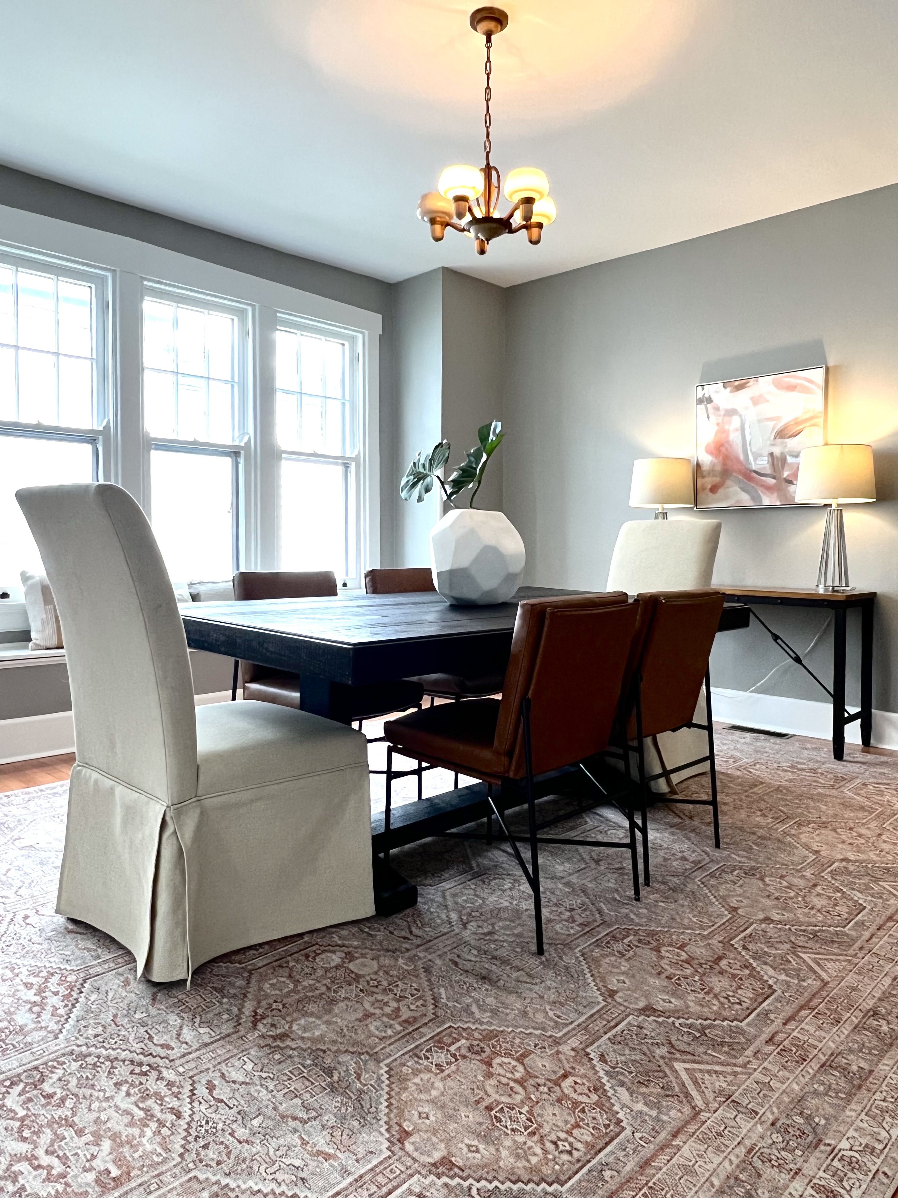 Dining room table with neutral walls and white trim